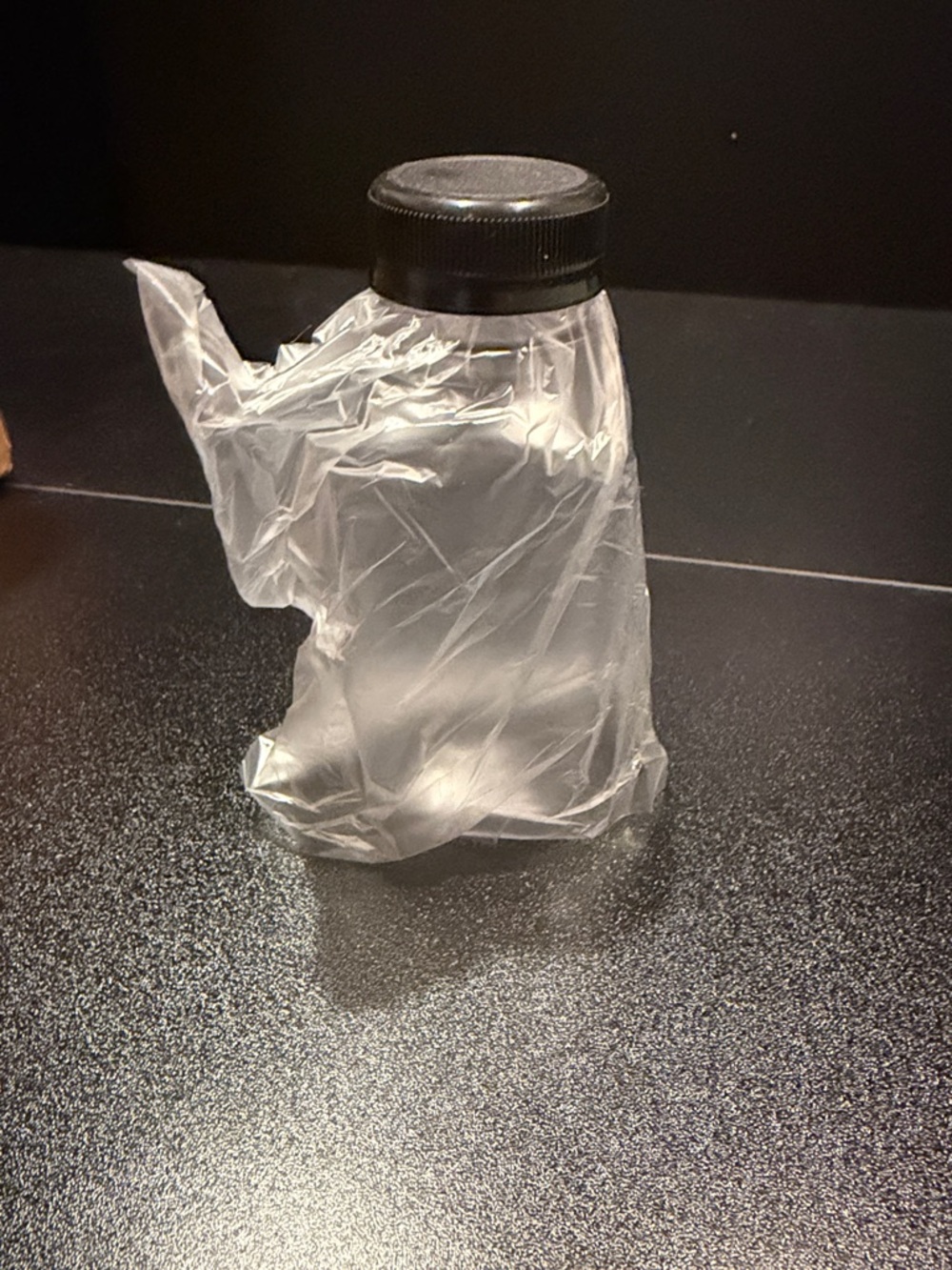 Clear Plastic Bottle with Black Cap